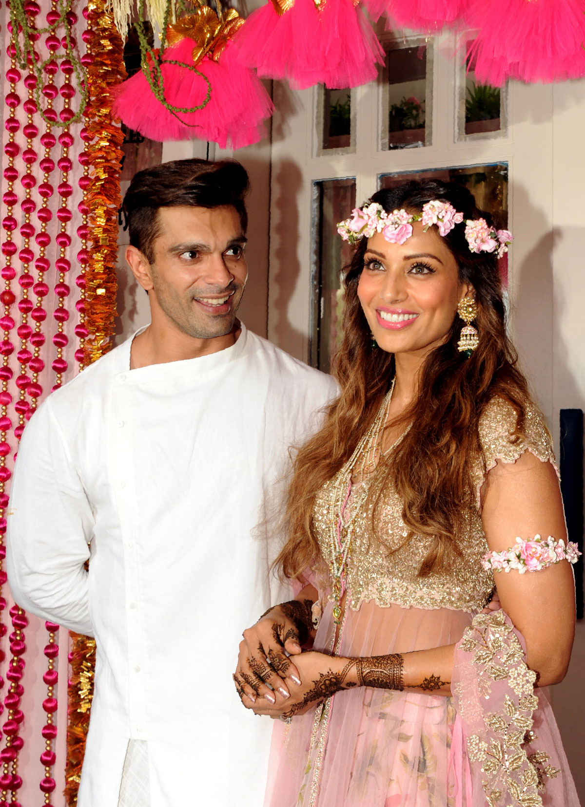Karan Singh Grover (l) and Bipasha Basu pose for a photograph during their mehendi ceremony in Mumbai, April 29. (AFP | Getty Images) 