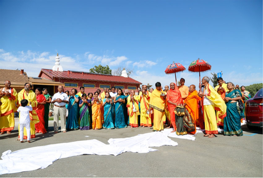 Narayananda Swami with devotees praying to Sun.