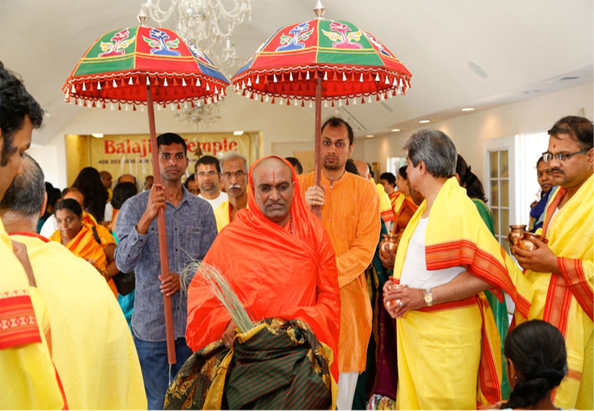 Narayananda Swami carrying “kalash” with devotees.