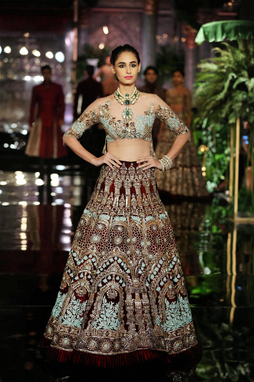 A model wearing Manish Malhotra walks the ramp on the opening day of India Couture Week 2016, in New Delhi. (Press Trust of India)