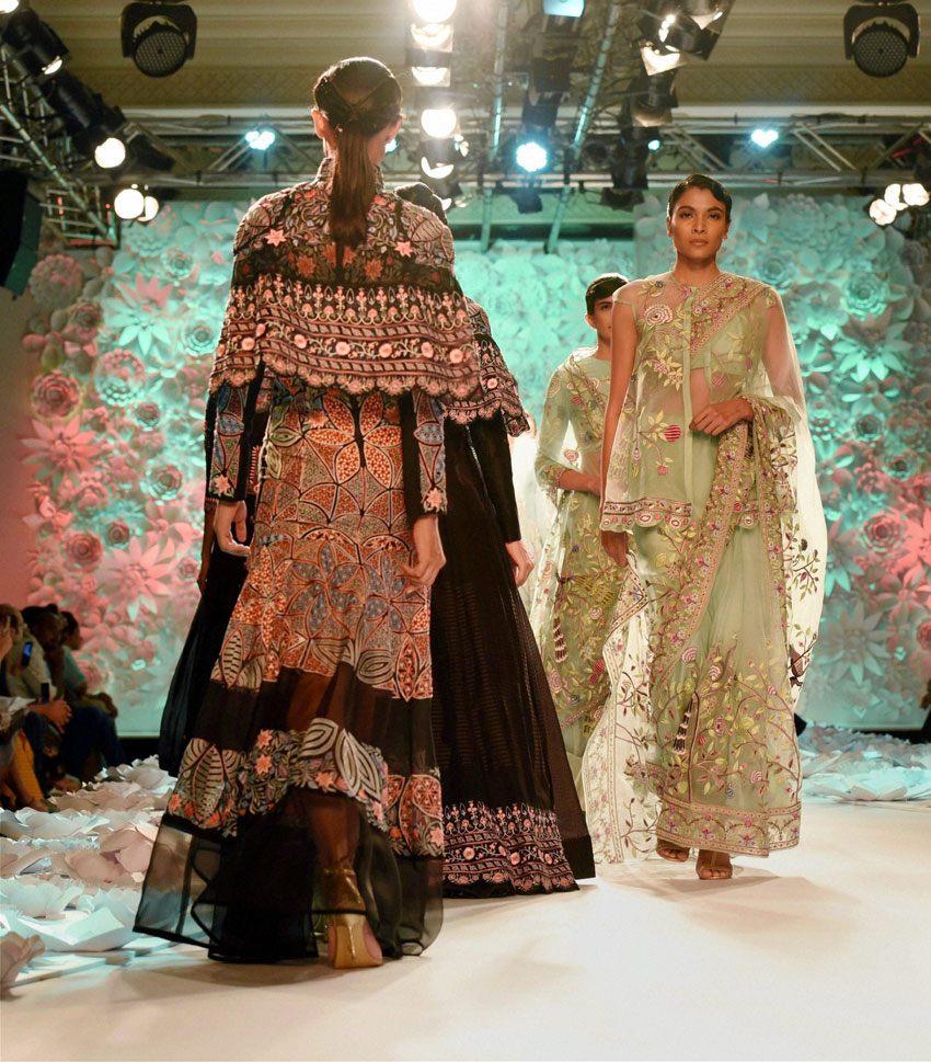 Models walk the ramp in clothes designed by Rahul Mishra during the India Couture Week 2016 in New Delhi. (Shirish Shete | PTI)