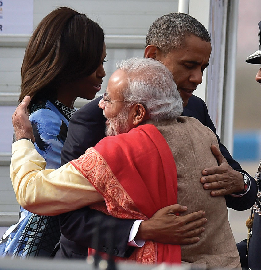 File photo of Prime Minister Narendra Modi as he hugs President Barack Obama and first lady Michelle Obama upon their arrival at Air Force station Palam, in New Delhi, Jan. 25, 2015. (Kamal Kishore PTI)