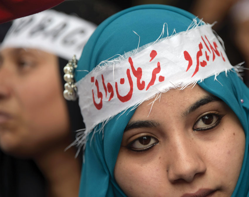 A Pakistani Kashmiri woman wears a headband that reads 'Our hero Burhan Wani,' – an Indian Kashmiri rebel – at an anti-India protest in Muzaffarabad, the capital of Pakistan-administered Kashmir, on July 27. (Sajjad Qayyum | AFP | Getty Images) 