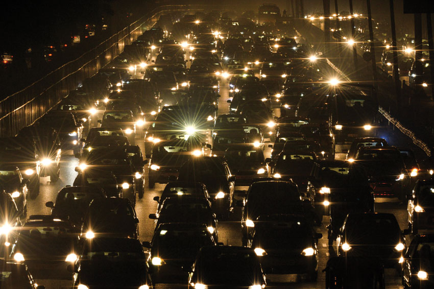 Commuters travel through a traffic jam on their way to New Delhi from Gurgaon. (Chandan Khanna | AFP | Getty Images) 
