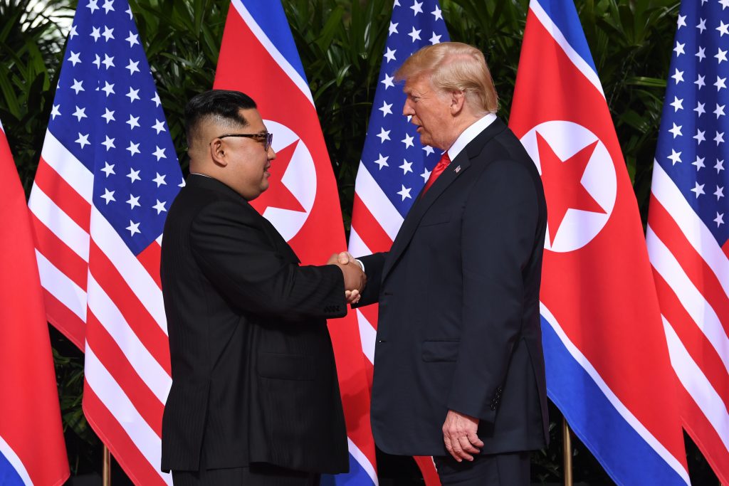 Siliconeer | Trump, Kim Share Historic Handshake | Siliconeer