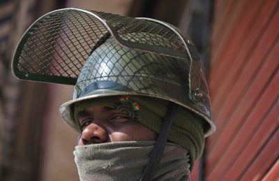 An Indian paramilitary trooper stands guard during a second day of strike called by separatists against the National Investigation Raids in Srinagar, Feb. 28. Pakistan and India said on Feb. 27 they had shot down each other's warplanes, in a dramatically escalating confrontation that has fueled concerns of an all-out conflict between the nuclear-armed rivals. (Tauseef Mustafa/AFP/Getty Images)