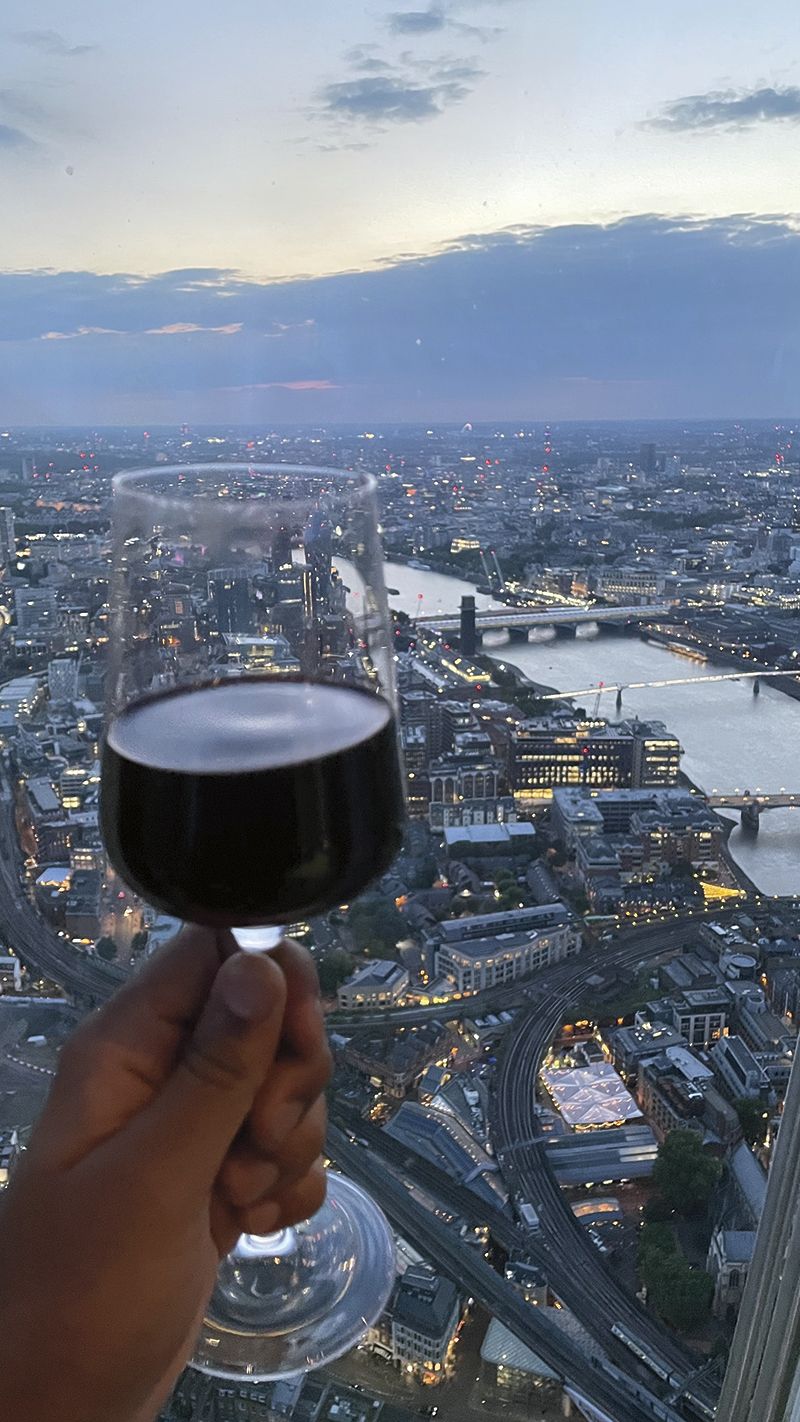 A glass of pinot overlooking the city of London at The Shard.